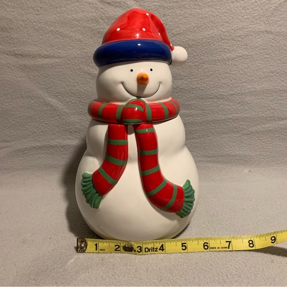Holiday Snowman Cookie Jar with Santa’s red hat and red/green striped scarf. - Picture 3 of 8